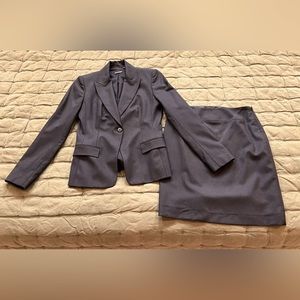 Women’s black pinstripe suit, skirt and matching jacket, Tahari, size 2